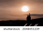 Silhouette Of A Town During...
