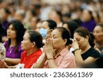 Small photo of Song Vinh catholic church. Catholic devotees during Holy Thursday Mass. Holy Thursday is the commemoration of the Last Supper of Jesus Christ. Vietnam. 04-30-2023