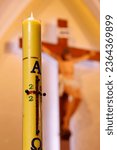 Small photo of Catholic church. Paschal candle is a large white candle used every year at Easter. Dalat. Vietnam. 04-30-2023