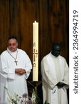Small photo of Saint Maurice church. Catholic mass. Paschal candle. France. 05-31-2023