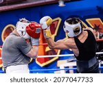 Small photo of HELSINKI, FINLAND – NOVEMBER 11 2021: Professional boxing: two-time European lightweight champion Edis Tatli (black shirt) sparring with Jussi Koivula at Ringside Gym