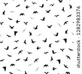 flying birds silhouettes on... | Shutterstock .eps vector #1282983376