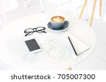 White desk table with  cup of...