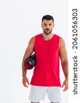 Small photo of Portrait of sympathetic young man holding foam roller in front of white background