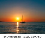 Sailboat At Sunset In The...