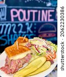 Small photo of Reuben sandwich with greek salad with pickles