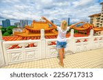 Small photo of tourist in Kuala Lumpur was astounded by exquisite architecture and impressive design of the renowned Thean Hou Temple. She was in awe of tranquil atmosphere and awestruck by shrine of Mazu goddess