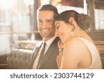 Well-dressed couple hugging in restaurant