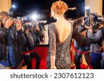 Celebrity leaving being photographed by paparazzi photographers at red carpet event
