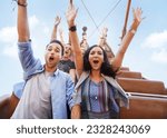 Portrait enthusiastic friends cheering on amusement park ride