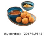 Small photo of Cheddar Jalapeno Popper Bites - Crispy Cheese Jalapeno Bacon Bites. Fried cheese balls with halopena on a white isolated background. Traditional Mexican food