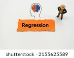 Small photo of Regression.The word is written on a slip of colored paper. Psychological terms, psychologic words, Spiritual terminology. psychiatric research. Mental Health Buzzwords.