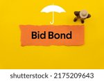 Small photo of Bid Bond.The word is written on a slip of colored paper. Insurance terms, health care words, Life insurance terminology. business Buzzwords.