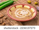 Small photo of Foul with tahini served in dish isolated on table side view of arabic food