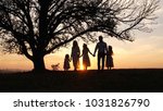 Silhouettes Of Happy Family...