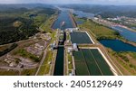 Small photo of Aerial view Panama Canal, third set of locks, water shortages, maritime traffic, water reuse vats, summer drought.