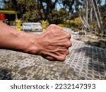 Small photo of man showing big and dashing muscles outdoor. muscular and sinewy hand. SSTKsports.