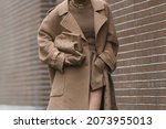 Small photo of Milan, Italy - September 22, 2021: Street style outfit, fashionable woman wearing a Fendi outfit on the streets of Milan, Italy.