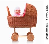 Small photo of Doll in plaited baby stroller, isolated on white background with shadow reflection. Tiny tots doll in baby stroller. Caucasian newborn baby doll in mail-cart. Dolly in pram on white background.