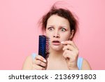 Small photo of teenager girl squeamish facial expression comb hair Lifestyle unaltered