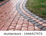 impregnated paving stones on the path not receiving rainwater