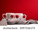 Cups full of love. Pleasure, inspiration, feelings contained in one word, which is love. A hot heart in a tender embrace. Perfect texture for a greeting card for a loved one.