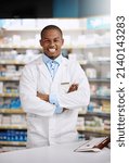 Small photo of Looking for expert advice Im right here to help. Portrait of a young pharmacist working in a chemist.
