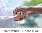 Small photo of Working together is how well get through this. Shot of unrecognizable people holding hands.