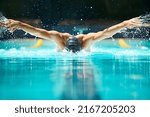 Small photo of Perfect butterfly stroke. Shot of a male swimmer doing the butterfly stroke toward the camera.