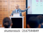 Small photo of Our figures speak for themselves. A mature businessman gesturing while giving a presentation at a press conference.