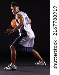 Small photo of Defend defend defend. Studio shot of a basketball player against a black background.