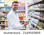 Small photo of Weve got a brand new range of stock in. Portrait of a mature pharmacist doing inventory in a pharmacy.