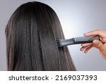 Small photo of Thick, glossy strands go a long way toward making hair look healthy. Studio shot of a woman with healthy brown hair.