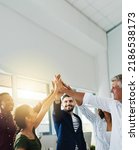 Small photo of Group of business people doing high five together while standing inside an office with sun flare and copy space. Team of colleagues, coworkers and employees celebrating teamwork and stacking hands