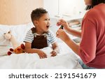 Sick child taking medicine syrup, flu treatment and cold cure for illness, sickness and virus symptoms. Mom caring for health of little son, kid and boy to rest, recover and get better in bed at