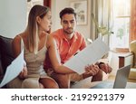 Small photo of Unhappy, stressed and upset couple paying bills or debt online on with a laptop at home getting angry, planning budget. Young man and woman having a dispute over finance, savings and increasing tax