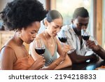 Friends red wine tasting fine dining experience at a vineyard restaurant for about us and hospitality. Group of black people glass of luxury, quality alcohol drink in a winery business or industry