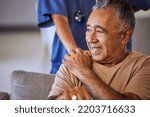 Nurse or doctor give man support during recovery or loss. Caregiver holding hand of her sad senior patient and showing kindness while doing a checkup at a retirement, old age home or hospital