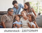 Relax, love and big family happy on sofa smile together in home on the weekend with children. Cheerful and diverse senior grandparents, parents and young kids in Brazil bond in living room.