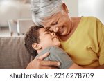 Happy family, child and grandma hug and bond in living room together, happy and content in their home. Relax, smile and love of boy hugging senior woman showing love and having fun in brazil house