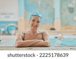 Small photo of Senior woman, swimmer in water and relax in swimming pool of hotel resort for healthy elderly exercise, swim training and fun with friends. Happy elder, smile on face and retirement workout activity