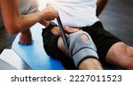 Small photo of Rehabilitation, woman therapist or knee brace in physiotherapy with senior man patient, knee pain or consulting expert. Physiotherapist, physical therapy and healthcare worker help, support or advice