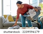 Small photo of Woman, laundry basket or spring cleaning in house, Indian home or hotel living room in hygiene maintenance, housekeeping healthcare or tidy wellness. Smile, happy maid and cleaner and clothes washing