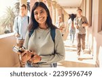 Small photo of University student, indian woman and portrait at campus outdoor with books of learning, education or knowledge, scholarship and motivation. Happy, smile and young college student, studying or academy