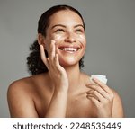 Small photo of Black woman, smile and face beauty cream for skincare wellness shine, cosmetics dermatology and salon spa product in studio. African girl, spf lotion and self care happiness for luxury facial glow