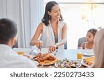 Small photo of Chicken, happy and family lunch with woman cutting with knife, meal and food in dining room or celebration event. Love, happiness and group of people eating or laugh at brunch in family home together