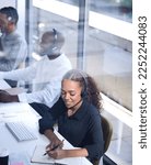 Small photo of Call center, customer support with a happy black woman consultant working in her telemarketing office. Contact us, crm and communication with a female consulting using a headset from above