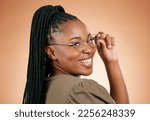 Black woman, portrait smile and glasses for fashion, style or smart casual against a studio background. Happy African American female model face smiling for eyewear, spectacles and sight or vision
