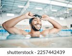 Small photo of Happy, man or relax in swimming pool with cap or goggles in sports wellness, training or exercise in body muscle. Workout, fitness or swimmer athlete with smile, water competition goals or healthcare