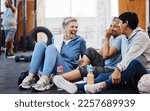 Small photo of Gym, laughing and group of mature women telling joke after fitness class, conversation and comedy on floor. Exercise, bonding and happy senior woman with friends sitting chatting together at workout.